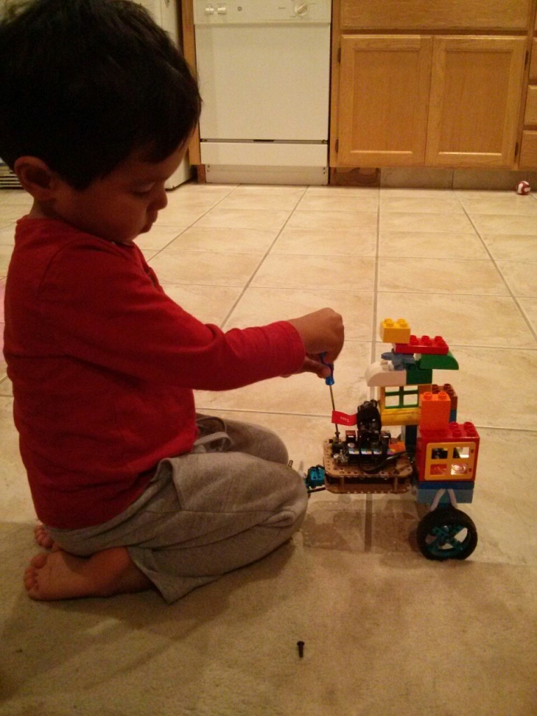 And finally, it was time for new batteries. I strapped some Legos to the frame. You put "one door for going in, and one door for going out."